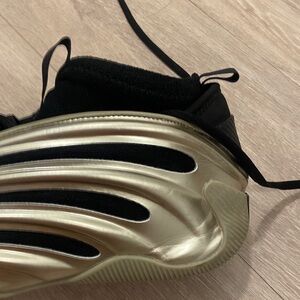 Metallic Gold Adidas Harden basketball shoes